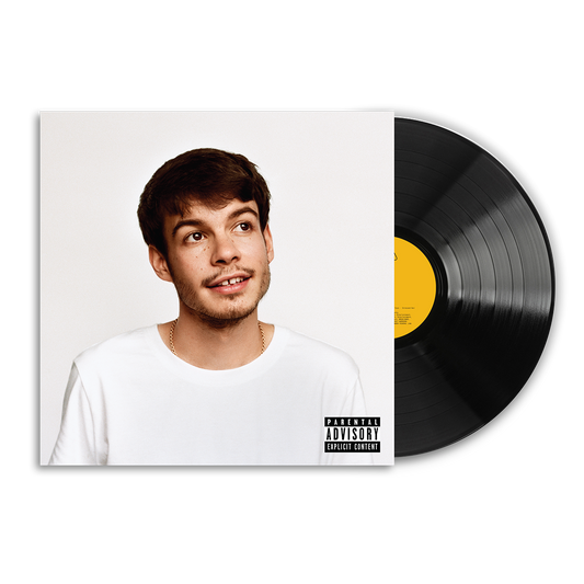 A vinyl record partially pulled from its sleeve, showing a portrait of Rex Orange County on the album cover and a visible Parental Advisory label. The record itself is black with a yellow center label.