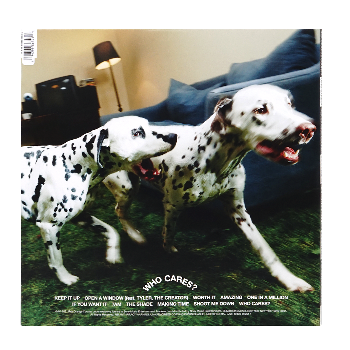 Vinyl record album cover for Who Cares? featuring two Dalmatian dogs in a living room setting, with the album tracklist printed at the bottom.
